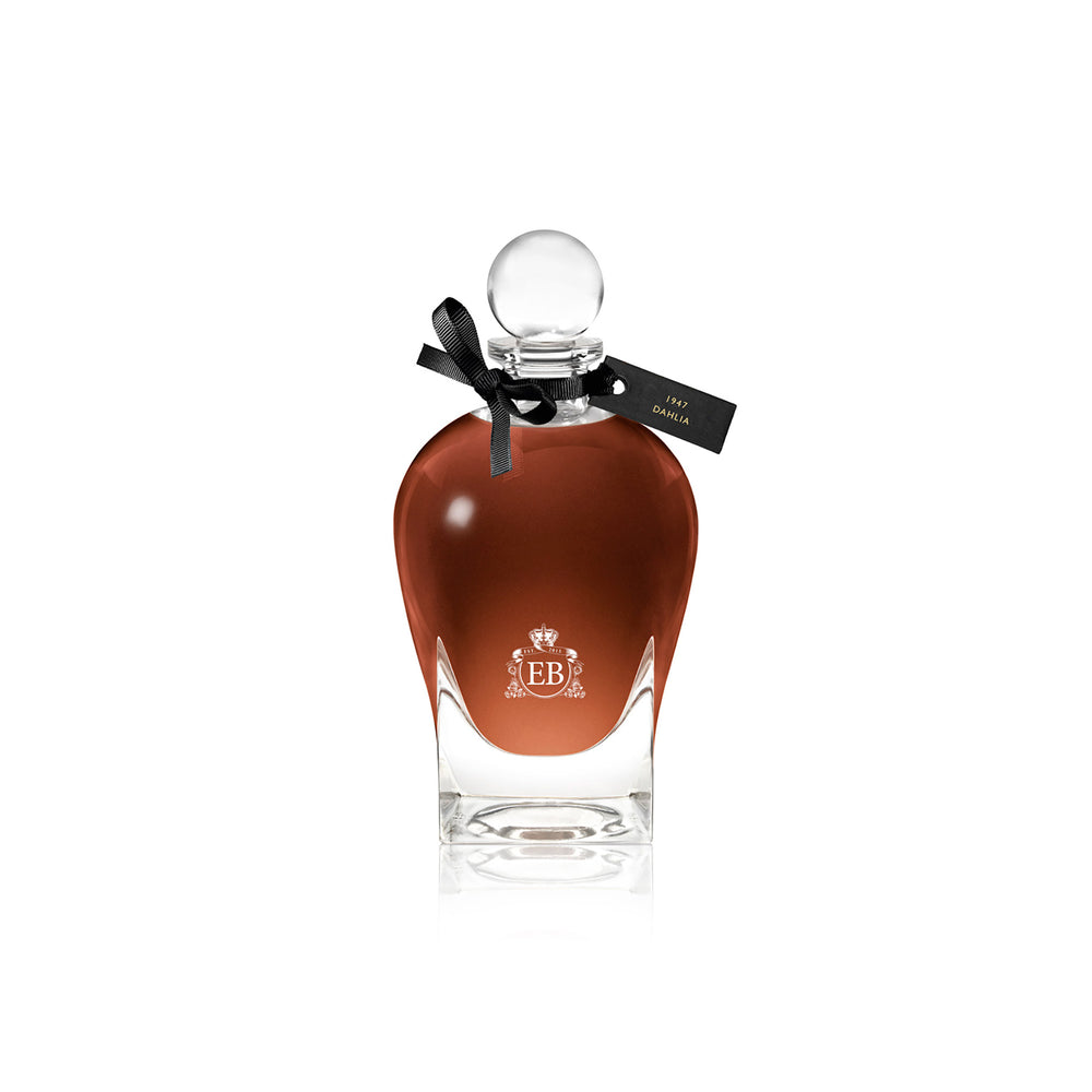 250 ml bottle, with transparent glass and amber perfum. Spherical cap with black ribbon. 1947 Dalhia, a fragrance by Eric Butherbaugh.