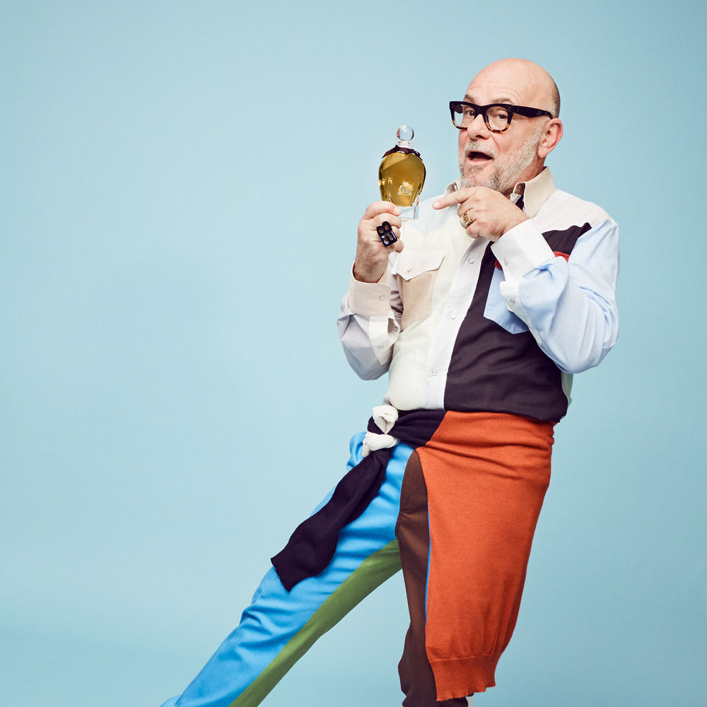 Eric Buterbaugh showing Apollo Hyacinth bottle on blue background.