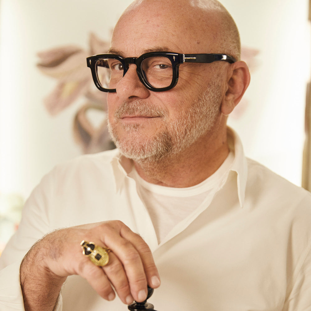 Close-up of Eric Buterbaugh looking at camera, in white tones. 