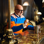 Eric Buterbaugh at a bar counter making a perfum cocktail.